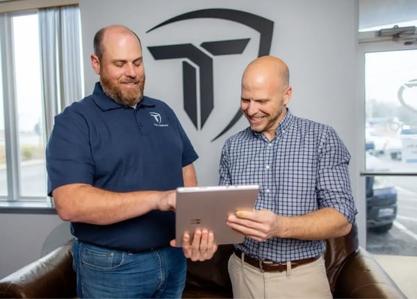Rob Brothers helps a business client with cyber security services