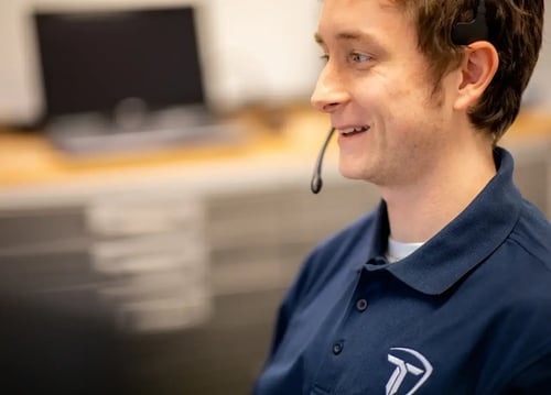 Nickolas Newnham staffs the help desk at TekTrendz